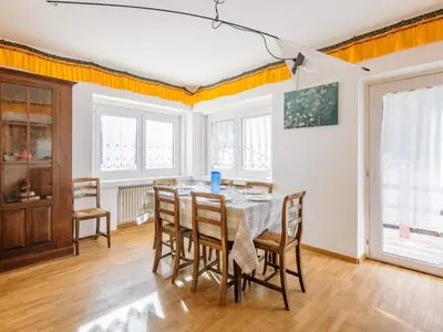 a dining room with a table and chairs at Apartment Cesa Giordi by Interhome in Canazei