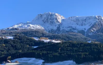 a mountain with snow on top of it at Apartment Rohrer - Zirm - Zirbe Cirmolo mit Schloss- und Schourtblick in Sarntal