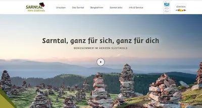 a screenshot of a website with a pile of rocks at Apartment Rohrer - Zirm - Zirbe Cirmolo mit Schloss- und Schourtblick in Sarntal