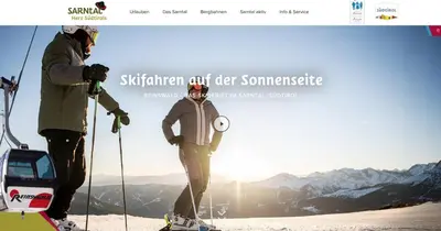 two people on skis standing on a ski slope at Apartment Rohrer - Zirm - Zirbe Cirmolo mit Schloss- und Schourtblick in Sarntal