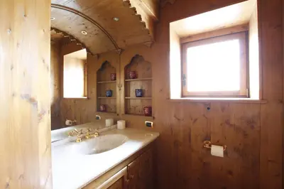 a bathroom with a sink and a mirror at Chalet Ampezzano di Marisa in Cortina dʼAmpezzo