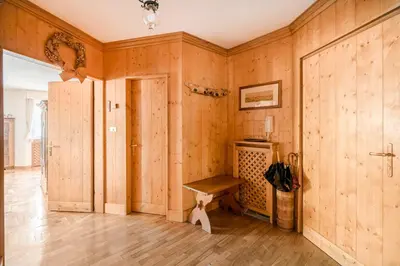 a room with wooden walls and a wooden bench at Dolce Casa Cortina Centro-Ski in Cortina dʼAmpezzo