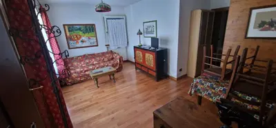 a living room with a couch and a table at Ca' Ravagnan in Cortina dʼAmpezzo