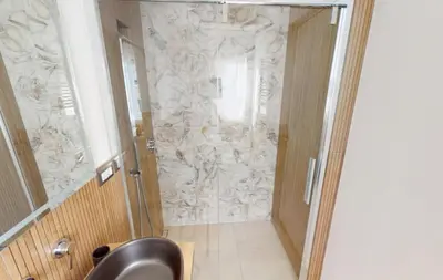 a bathroom with a shower with a glass door at Manzoni 99 in Merano