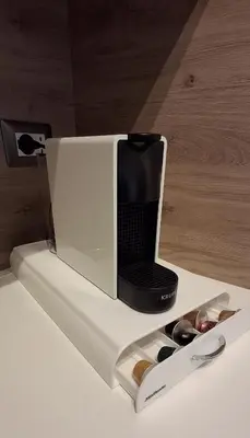 a microwave sitting on top of a table with scissors at Manzoni 99 in Merano