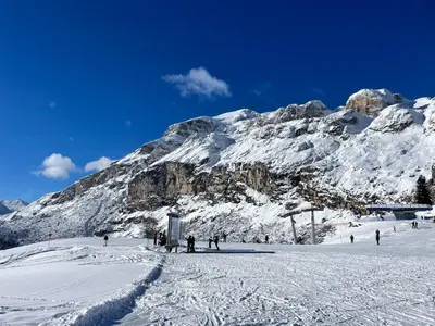 a group of people standing on a snow covered mountain at Sport Hotel Astoria Residence in La Villa