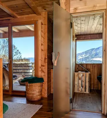 a door to a cabin with a view of the mountains at Froetscherhof, Urlaub auf dem Bio-Bauernhof in Brixen, Appartments, Sauna und BrixenCard in Bressanone