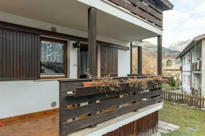 a wooden fence on the side of a house at Trilo Ciasa de l'Ora in Cavalese