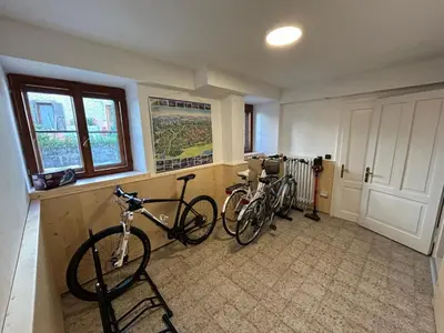 a room with two bikes parked in a room at Appartamento Dolomiti Dream 2 in Falcade