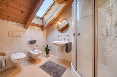 a bathroom with a toilet and a sink and a shower at FaWa Apartments 