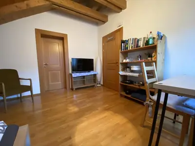 a living room with a wooden floor and a television at FaWa Apartments 