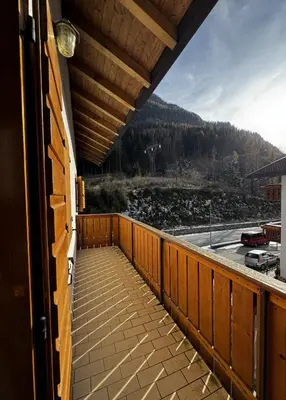 a balcony of a house with a view of a mountain at 7 min dal centro, top per sciare e park in Piaia
