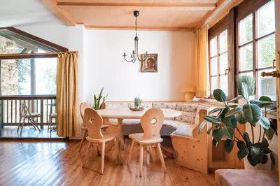 a dining room with a table and chairs at Apartments Ansitz Wieshof in Castelvecchio