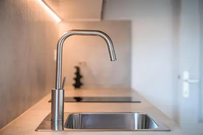 a stainless steel sink in a kitchen with a counter at Pool Apartments Edith in Lana