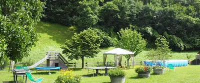 a park with a playground with a slide at Tommele Hof in Volser Aicha