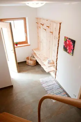 a room with a wooden shelf on the wall at Laerchhof in Collalbo