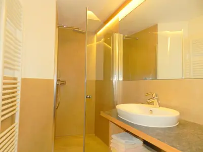 a bathroom with a sink and a shower at Laerchhof in Collalbo