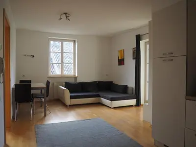 a living room with a couch and a table at Saint Martin Guest House in Cornaiano