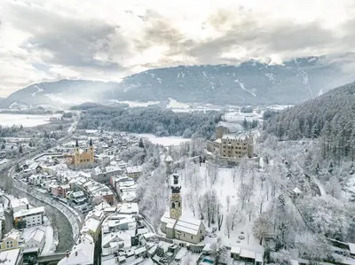 an aerial view of a city covered in snow at apartment beletage in San Lorenzo di Sebato