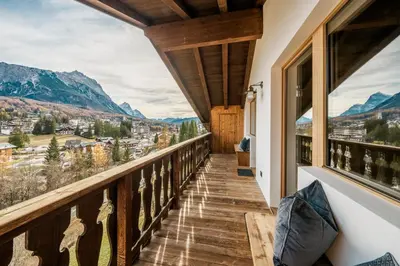 a balcony with a view of the mountains at Chalet Ronco - Dolomiti Skyline in Cortina dʼAmpezzo
