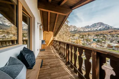a balcony with a view of the mountains at Chalet Ronco - Dolomiti Skyline in Cortina dʼAmpezzo