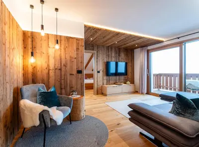a living room with a couch and a tv at Sule Hof Agriturismo in Ortisei