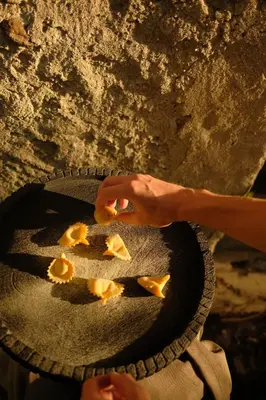 a person is eating food in a bowl at Hotel Mühlbacherhof in Lagundo