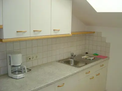 a kitchen counter with a sink and a coffee maker at Residence Adler in Tesimo