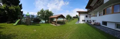 a yard with a playground and a gazebo at Pension Pepi - Apartments I Bed - Breakfast in Perca