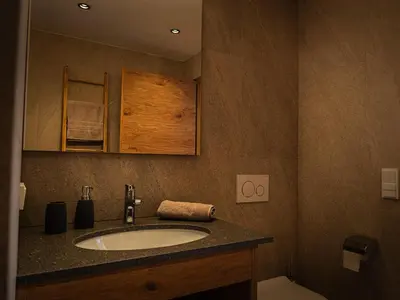 a bathroom with a sink and a toilet at Gruberhof Lana - NEW! in Lana