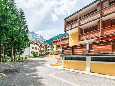 an empty parking lot in front of a building at Apartment Condominio Val di Fassa-3 by Interhome in Alba di Canazei
