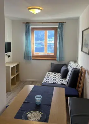 a living room with a couch and a table at Apartements Mitterstill in Fiè