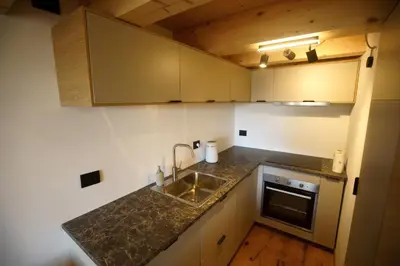 a kitchen with a sink and a counter top at A93A Apartment Alicia in Carano