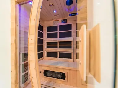 a sauna in a wooden cabin with windows at Apartments Ansitz Wildberg in San Lorenzo di Sebato
