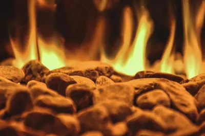 a close up of a fire in a fireplace at Kirchwies Naturchalet - Adults Only in Laion