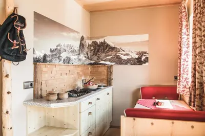 a kitchen with a counter and a stove in a room at Kirchwies Naturchalet - Adults Only in Laion