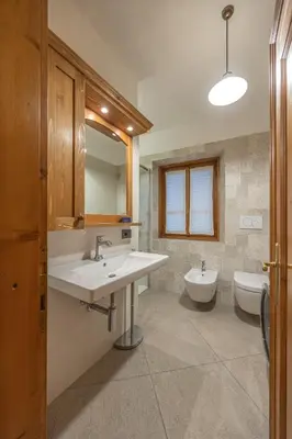 a bathroom with a sink and a toilet at Casa Zardini, in centro a Cortina d'Ampezzo in Cortina dʼAmpezzo