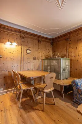 a wooden dining room with a wooden table and chairs at Casa Zardini, in centro a Cortina d'Ampezzo in Cortina dʼAmpezzo