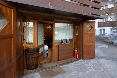 an outside view of a building with a room with a sink at Chiara Home, in centro a Cortina d Ampezzo in Cortina dʼAmpezzo