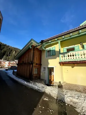 a house on the side of a street at Cèsa Emily in Campitello di Fassa