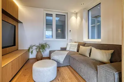a living room with a couch and a tv at HOMESTWENTY3 - Home six in Caldaro