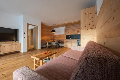 a living room with a couch and a table at A-Lunis in Brunico