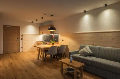 a living room with a couch and a table at A-Lunis in Brunico