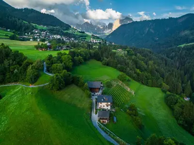 an aerial view of a house in a green field at Spinuserhof in Tires