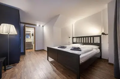 a bedroom with a large bed in a room at Apartments No7 Sella in Ortisei