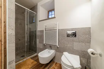 a shower with a glass door in a bathroom at Antica Dimora Cotai in Canale dʼAgordo