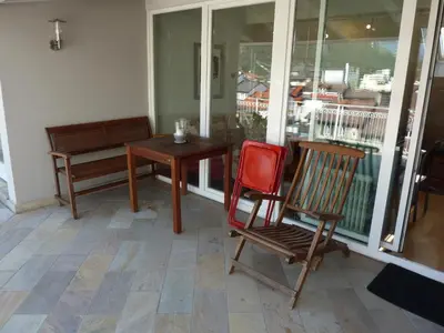 a room with a table and two chairs and a table and a table at Apartment Leonardo in Bolzano