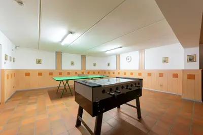 a set of tables with plates and napkins on them at Hotel Villa Jolanda in Ziano di Fiemme