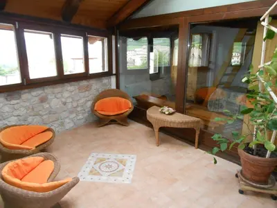 a living room with chairs and a table at Casa Vacanze Fontana in Coredo