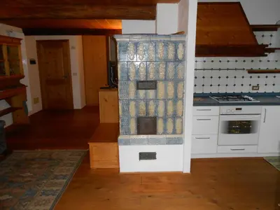 a kitchen with a stove and a counter top at Casa Vacanze Fontana in Coredo